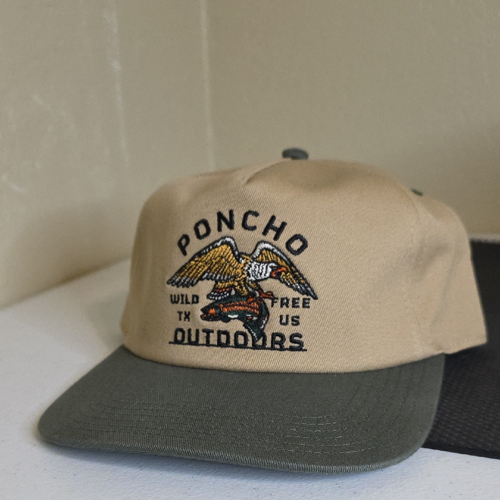 Poncho Tan and Green Cap